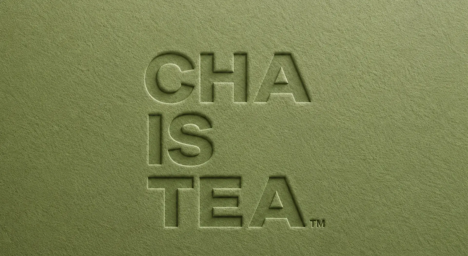 CHA IS TEA logo embossed on matcha-green paper